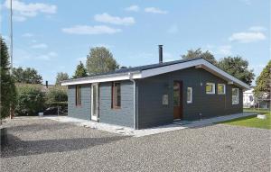 a small gray building with a roof at Two-Bedroom Holiday Home Broager With A Fireplace 07 in Broager