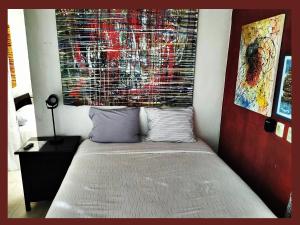 Postel nebo postele na pokoji v ubytování Casa del Pintor Chetumal