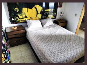 Postel nebo postele na pokoji v ubytování Casa del Pintor Chetumal