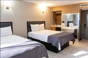 Postel nebo postele na pokoji v ubytování Hotel Moca NYC