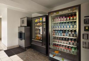 a soda machine in a store with soda bottles at Motel 6-Morro Bay, CA in Morro Bay