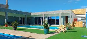 a house with a swimming pool in the yard at Residência Águia in Praia