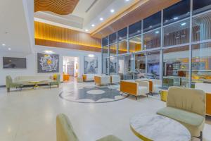 a lobby with chairs and tables in a building at Best Western Plus Khan Hotel in Antalya