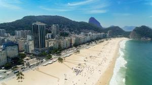 an aerial view of a beach and the ocean at Hilton Copacabana Rio de Janeiro in Rio de Janeiro