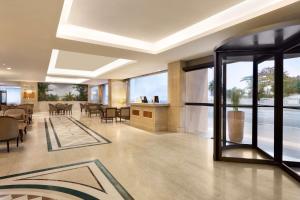 a lobby of a hotel with a dining room at Hilton Copacabana Rio de Janeiro in Rio de Janeiro +92 photos