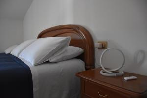 Postel nebo postele na pokoji v ubytování Monte Cucco B&B