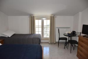 Postel nebo postele na pokoji v ubytování Monte Cucco B&B