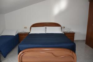 Postel nebo postele na pokoji v ubytování Monte Cucco B&B