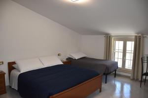 Postel nebo postele na pokoji v ubytování Monte Cucco B&B