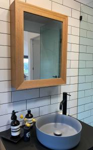 a bathroom with a sink and a mirror at Sundays in Middleton +17 photos
