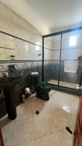 a bathroom with a toilet and a sink and a shower at LIVE APARTMENTS Cartagena in Cartagena de Indias