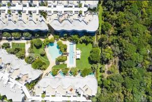 an aerial view of a house with a pool at Cotton Beach Resort - Holiday Management in Kingscliff