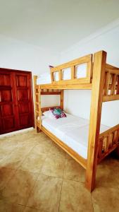 two bunk beds in a room with a door at LIVE APARTMENTS Cartagena in Cartagena de Indias