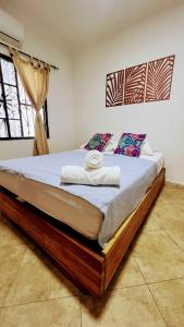 a bedroom with a bed with towels on it at LIVE APARTMENTS Cartagena in Cartagena de Indias