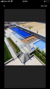 an overhead view of two swimming pools in a building at Apartamento c/ Suíte DF Plaza - Vista Espetacular in Brasilia