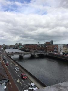 a bridge over a river in a city with cars at 39 Camden Wharf in Cork