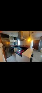 a kitchen with white counter tops and a stove at Condominio Dumont in Canoas