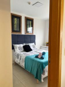 Postel nebo postele na pokoji v ubytování Apt 2 suítes, vista esplêndida Dfplaza