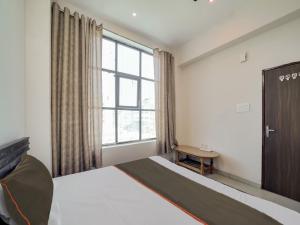 Lova arba lovos apgyvendinimo įstaigoje Super Collection O SHRI BALAJI HOTEL AND RESTAURENT