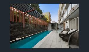 a swimming pool in the middle of a building at Discover urban bliss in our 1-bedroom King bed apartment! City views and cultural gems in Brisbane