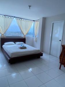 Postel nebo postele na pokoji v ubytování Crucita con Guardianía y acceso a Playa Privada y Piscina