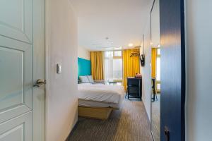Ένα ή περισσότερα κρεβάτια σε δωμάτιο στο Little Prince Hotel