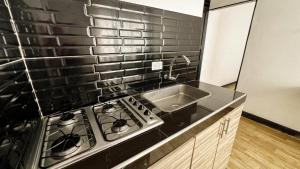 Köök või kööginurk majutusasutuses Apartamentos FM Loft 303