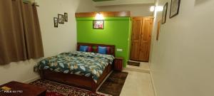 Postel nebo postele na pokoji v ubytování The Moon Light Home stay