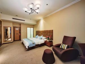 Postel nebo postele na pokoji v ubytování Chongqing Milky Way Hotel