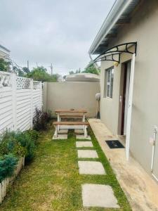 a picnic table in the backyard of a house at 24 on Elizabeth in East London