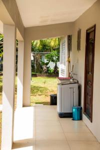 an entrance to a house with a counter and a door at Family Homestay in Nadi