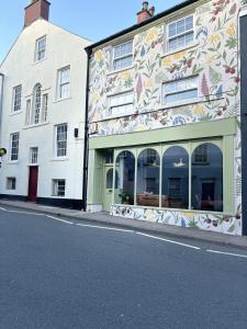 a building with a mural on the side of it at Hardy Hideaway in Ulverston