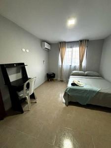 Postel nebo postele na pokoji v ubytování Acogedor apartaestudio con parking en Cartago