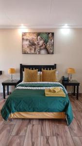 Ένα ή περισσότερα κρεβάτια σε δωμάτιο στο South Gate Lodge