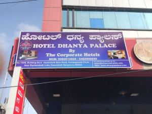 een bord voor een hotel apotheek paleis op een gebouw bij Hotel Dhanya Palace By Corporate Hotelz in Bangalore