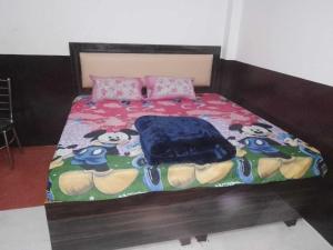 Ένα ή περισσότερα κρεβάτια σε δωμάτιο στο Hotel O Home KD Group Homestay