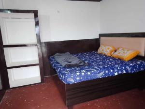 Ένα ή περισσότερα κρεβάτια σε δωμάτιο στο Hotel O Home KD Group Homestay