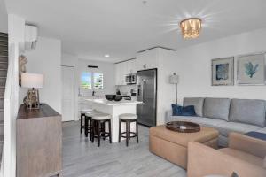 a living room and kitchen with a couch and a table at Keys Wade NEW 1B 2Bath in Marathon