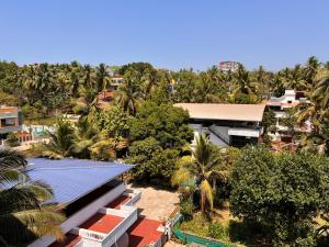 an aerial view of a resort with palm trees at Nirvana Stay, Spacious Fully furnished 2bhk apartment in Mangalore, Full AC in Mangalore