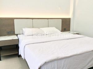Postel nebo postele na pokoji v ubytování TERRA Guesthouse JEC Mitra RedDoorz