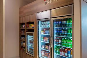 a refrigerator filled with lots of soda and sodas at Residence Inn Miami Sunny Isles Beach in Miami Beach