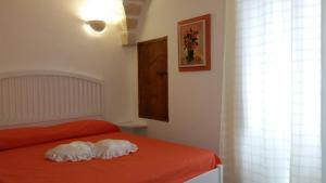 A bed or beds in a room at Il Rifugio Sul Mare