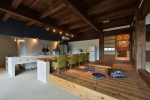 a kitchen and dining room with a table and chairs at 一棟貸し古民家の宿まるがやつ in Ōtaki +38 photos