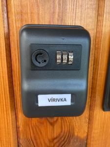 a switch on a wooden door with the word vitka at Studio Manzarda in Liptovský Mikuláš +14 photos