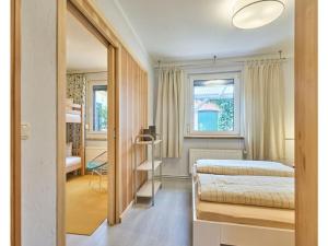 a bedroom with a bed and a window at Atelier Gaesthaus in Sietow Dorf