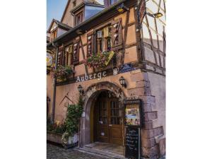 an old building with an archway in a street at Holiday house on Bornfeld in Leimen