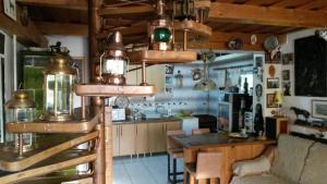 a kitchen and dining room with a table in a room at Transylvania Cowboy Cottage in Cluj-Napoca