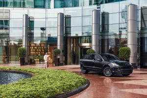 a black car parked in front of a building at Jumeirah Living World Trade Centre Dubai in Dubai