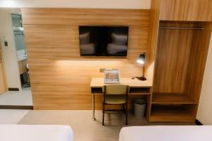 TV a/nebo společenská místnost v ubytování L' Meridian Suites