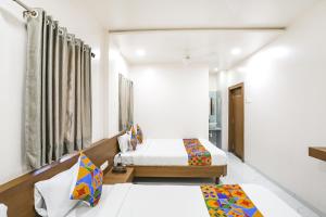 Postel nebo postele na pokoji v ubytování Hotel D Grand + 16 fotografií